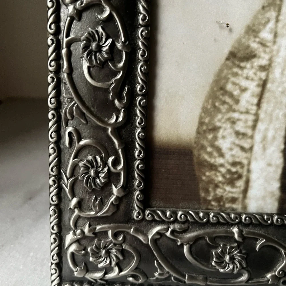 Large ornate silver Frame for photo 8”x10” free standing..